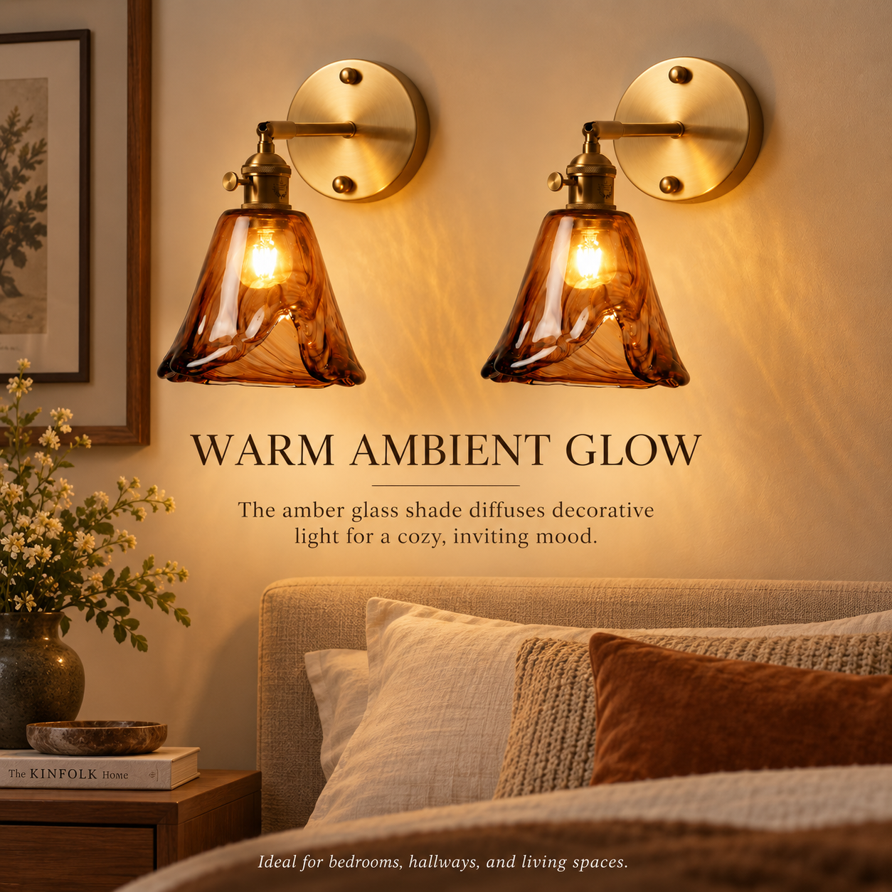 Two amber glass wall sconces creating warm ambient light in a bedroom