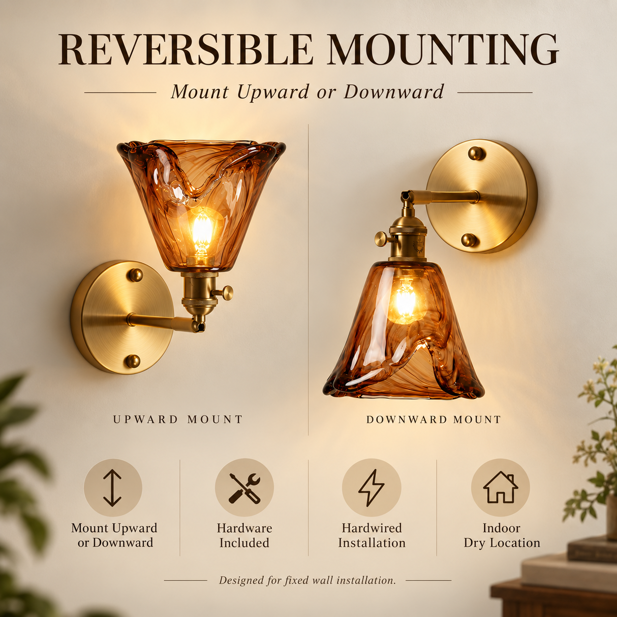 Reversible amber glass wall sconce mounted upward and downward