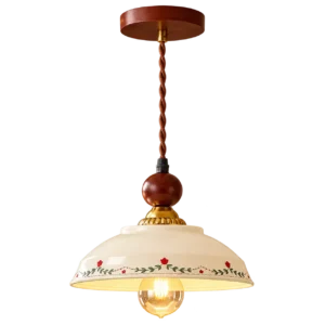 Vintage floral pendant light with a cream ceramic shade and bulb turned on